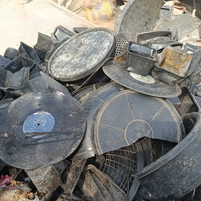 Pile of sorted black plastic tubs, basins and trays